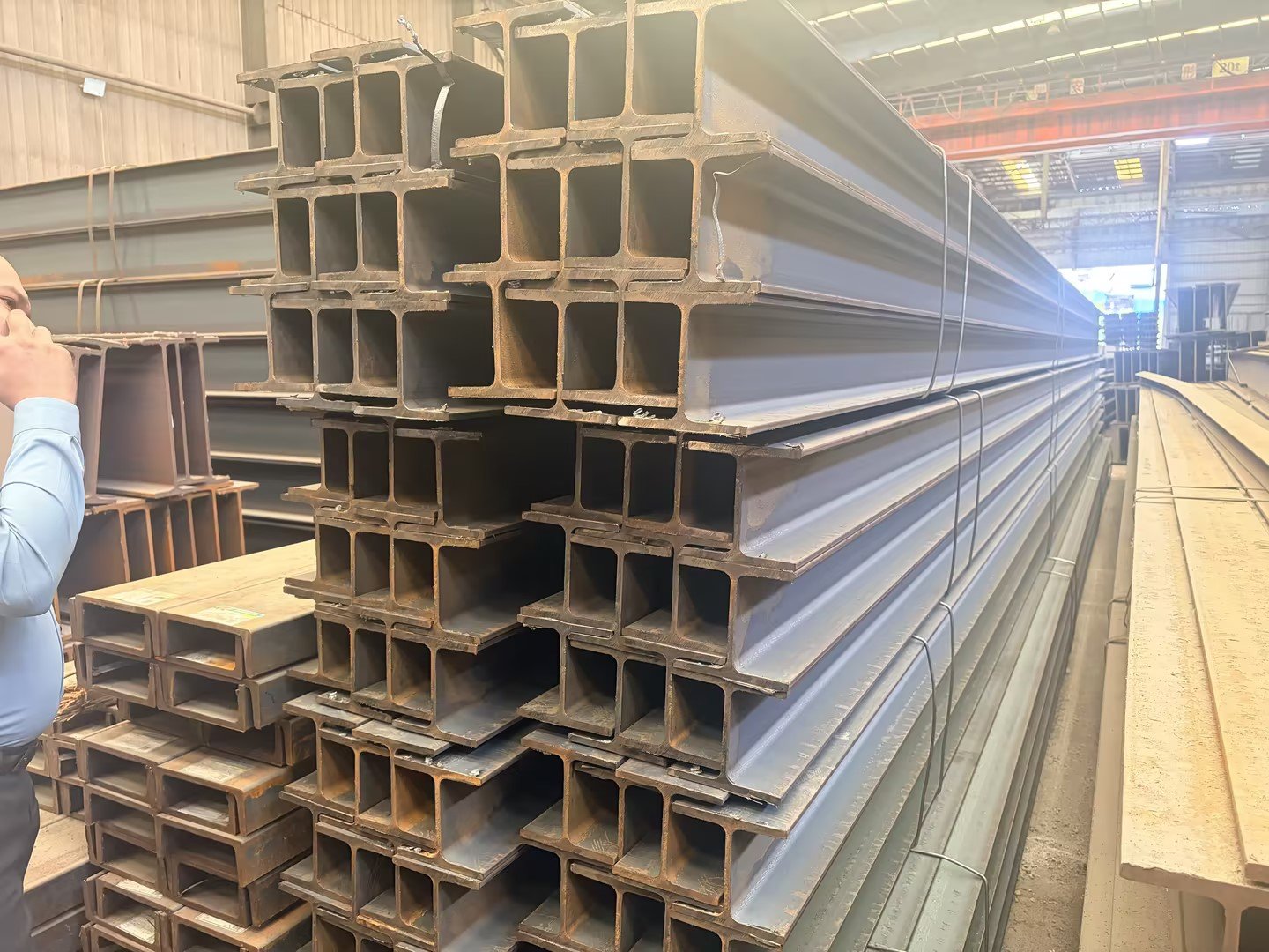 Customer inspecting steel sections at yard